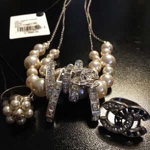 Necklace.  Two Chanel gift comes with purchase.